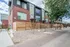 Modern townhouses with stylish brick and panel exterior, featuring landscaped pathways and inviting urban charm.