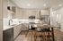 Elegant modern kitchen with sleek cabinetry, stainless steel appliances, and a chic breakfast bar with stylish seating.
