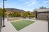 Stunning tennis court facility with scenic mountain views in the background, perfect for active lifestyle enthusiasts.