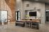 Modern communal area with elegant wood accents, large TV, and stylish seating, perfect for gatherings.