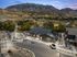 Charming residential area surrounded by scenic mountains, featuring a modern community center and well-maintained sports courts.