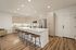 Modern kitchen with sleek cabinetry, stainless steel appliances, and a spacious island with stylish bar stools.