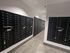 Modern and secure mailroom with sleek black mailboxes, perfect for a contemporary apartment complex.