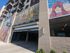 Modern apartment building entrance with vibrant artistic murals, showcasing a stylish and welcoming atmosphere.