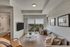 Inviting apartment living room with a plush beige sofa, stylish decor, and scenic balcony view.