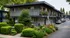 Charming apartment complex surrounded by lush greenery and vibrant landscaping, offering a serene setting with modern amenities.