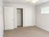Bright, spacious room with plush carpeting, a ceiling fan, and ample closet space, perfect for a serene retreat.