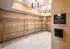 Modern package room with sleek metal shelving and stylish lighting, offering spacious organization solutions.
