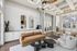 Luxurious apartment lounge with elegant furniture, high ceilings, and abundant natural light.