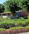 Charming residential property surrounded by lush greenery and vibrant landscaping at Mill Run.