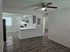 Chic apartment interior featuring an open-plan living and kitchen area with modern finishes and stylish wood flooring.