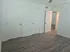 Bright room with elegant hardwood floors, featuring three pristine white doors enhancing modern living space.
