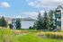 Charming apartment complex with lush gardens and serene walking paths, offering a perfect blend of nature and community living.