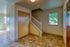 Welcoming interior with elegant hardwood finishes, an inviting staircase, natural light, and spacious closet space.