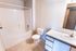 Bright, modern bathroom with sleek fixtures featuring a full bathtub, elegant sink, and ample counter space.
