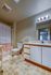 Charming bathroom with a modern vanity, subtle lighting, and elegant tiled flooring, perfect for relaxation.