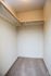 Bright and spacious walk-in closet with ample shelving and modern design, perfect for organized living.