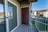 Charming balcony view from a modern apartment, showcasing a vibrant neighborhood and serene surroundings.