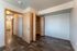 Bright and spacious room with elegant wood flooring and ample closet space.