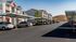 Charming apartment complex featuring modern architecture with covered parking and serene surroundings.