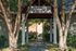 Charming entrance to the management office with beautiful trees and a welcoming pathway.