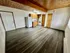 Bright open-concept apartment with modern wood floors, cozy kitchen, and natural light.