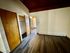 Inviting room with elegant wood flooring, ample closet space, and warm wooden accents.