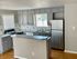 Large kitchen with stainless appliances