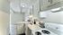 Charming kitchen with updated cabinets in selected apts, elegant countertop, seamlessly blending into a bright, inviting living space.