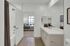 Spacious modern apartment bathrooms with large mirrors at Enclave Heritage Flats