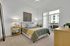 Spacious apartment bedrooms with carpet and access to the apartment patio in homes at Enclave Heritage Flats