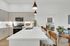 Bright apartment kitchen with Euro-style cabinets in homes at Enclave Heritage Flats