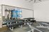Free weights in the community two story fitness center at Enclave Heritage Flats