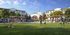 Vibrant community park surrounded by modern apartments, featuring lush greenery, shaded seating areas, and families enjoying outdoor activities.