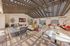 Chic rooftop lounge with stylish seating, vibrant decor, and a modern fire pit under an elegant pergola.Amenity building located at 1800 Santa Carolina Road in Chula Vista, California.