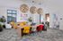 Vibrant and stylish communal wifi work lounge with modern decor, colorful seating, and artistic wall displays enhanced by natural light.Amenity building located at 1800 Santa Carolina Road in Chula Vista, California.