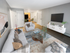 Apartment living room with dining area and open layout at Aladdin Village in Derry, NH