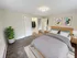 Spacious bedroom with large closet, soft carpet flooring, and modern furnishings at Westgate Arms in Salem, New Hampshire