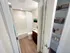 Full bathroom with tub and shower, wood-style flooring, and adjacent linen closet at Westgate Arms apartments in Salem, New Hampshire