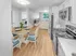 Kitchen with stainless steel appliances and adjacent dining area in a staged apartment at Westgate Arms in Salem, New Hampshire