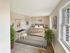 Bedroom with large windows, carpeted flooring, and ample natural light at Meadowbrook Village in Gardner, Massachusetts