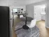 Apartment dining area and living room with natural light at Woodlands at Nashua in Nashua, NH