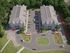 Aerial view of Grassfields Commons in Dracut, Massachusetts showing building layout, parking areas, and landscaped grounds