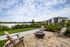 Ridgelake | Seating Area Next to Lake with Building in Background