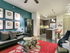 Beautiful, spacious living and kitchen area with large islands, concrete flooring, stainless steel appliances and pendant lighting