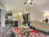 Beautiful, spacious living rooms with concrete flooring, ceiling fans and natural lighting