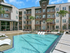 Sparkling Pool with Lounge Seating and Tanning Deck