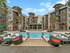 Sparkling Pool with Lounge Seating and Tanning Deck