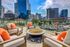 Cozy fire pit with lounge chairs, and stunning downtown views of Dallas