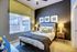 Bedroom with natural lighting, ceiling fan, and carpet